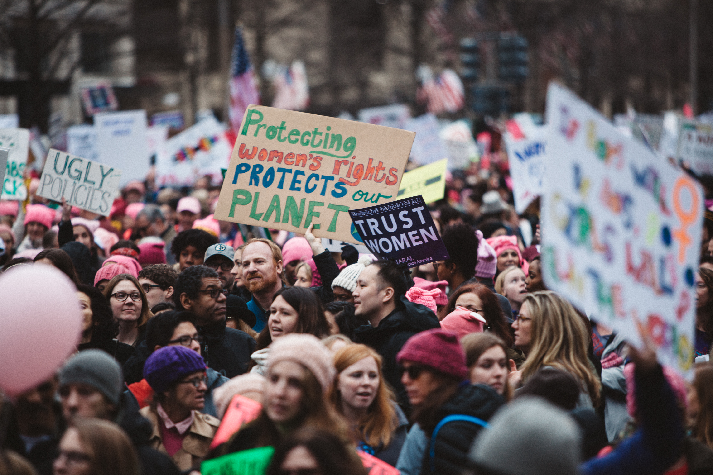 Protest sign that reads "Protecting Women's Rights Protects the Planet"