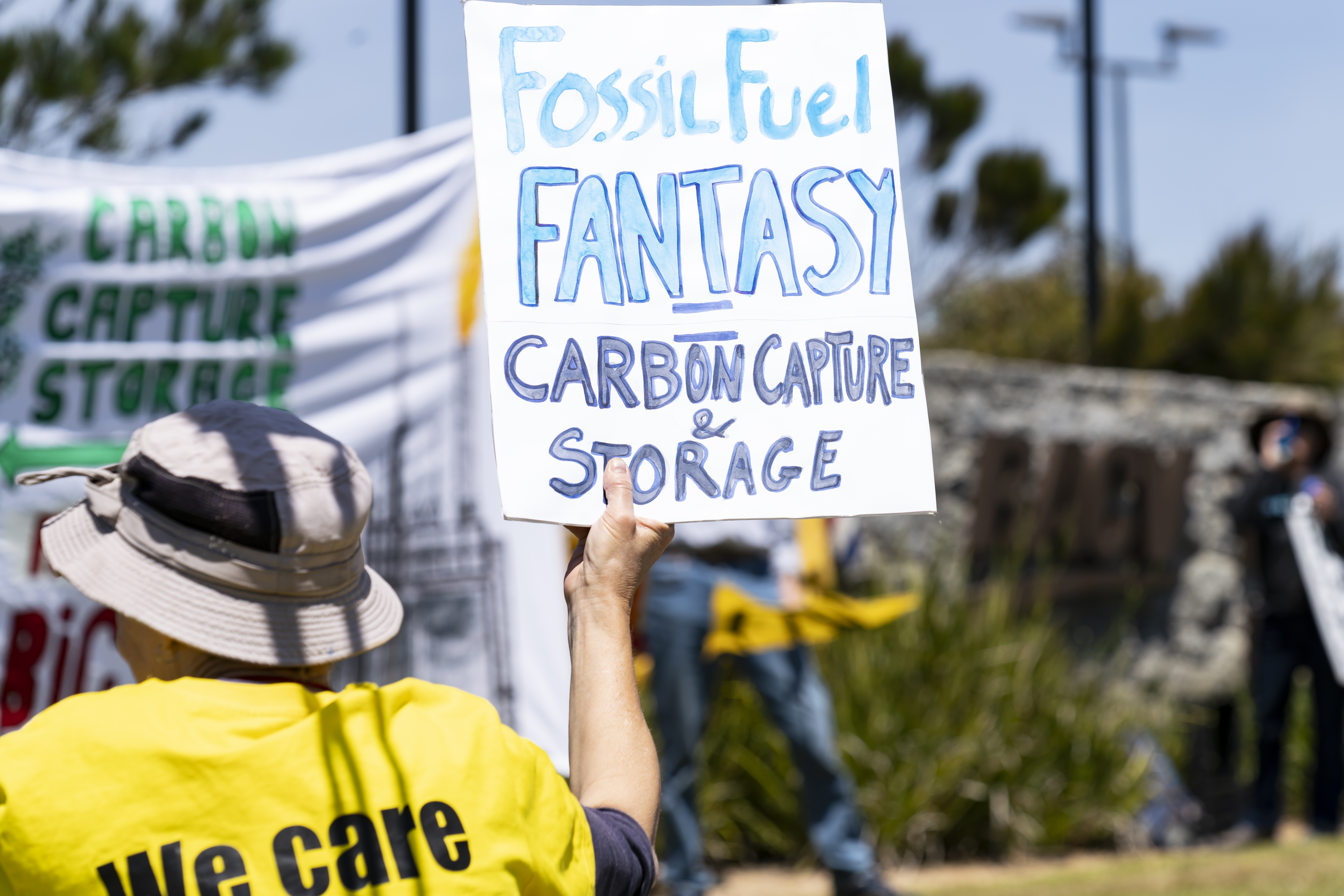 Climate activist holds sign at protest