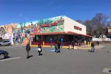 People socially distance in line at a Massachusetts grocery store