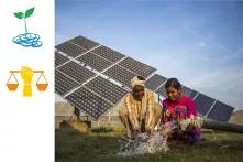 Man and woman wash hands in front of solar panels