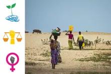 Women carrying water during a drought