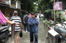 Man stands in flooded street