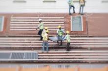 Workers install solar panels