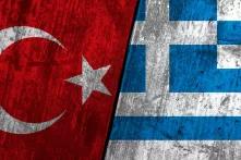 flags of turkey and greece next to each other