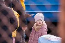 Ukrainian child flees war in Ukraine