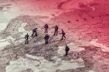 toy soldiers standing on a map of central and eastern europe