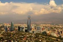 cit skyline with a few very large skyscrapers and mountains in the background