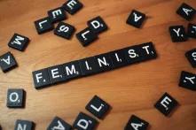 blocks from scrabble that spell out "feminist"