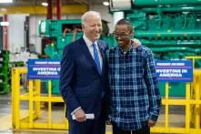 President Biden with a man inside a power facility