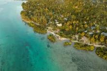 photo of small buildings on an ocean coast