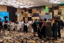 attendees huddle at the fifth, impromptu meeting of the Transitional Committee