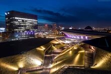 stairs and grassy slopes in an urban setting at night