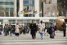 women walking together in front of UN headquarters