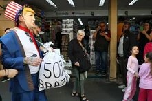 protest featuring a caricature of Trump