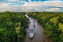 Landscape photo of boats on the river in the Amazon