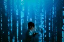 young person surrounded by blue code