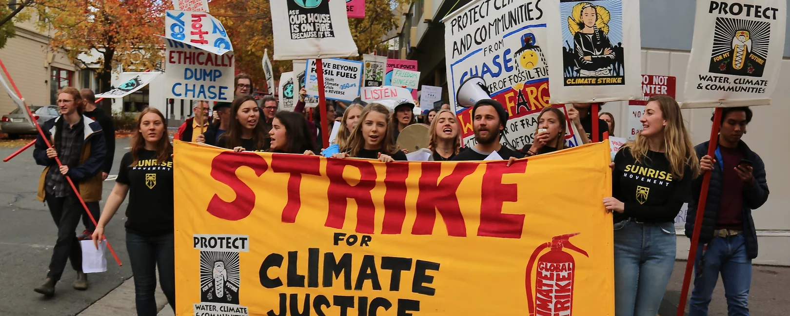 protesters in the US carry a sign saying 
