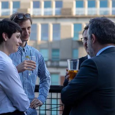 People are talking with each other at the Transatlantic Networking Happy Hour