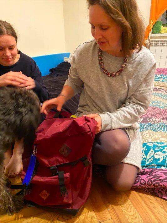 Woman packs backpack