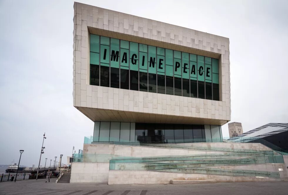 building with large sign that says "imagine peace"