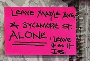 sticky note that says "leave maple ave and sycamore st ALONE. leave it as it is""