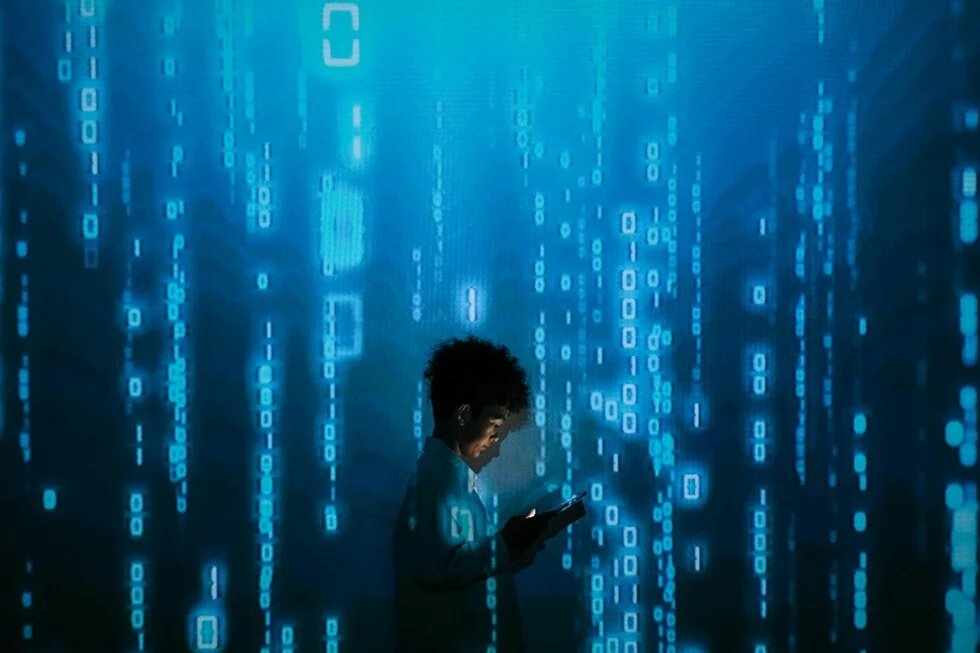 young person surrounded by blue code