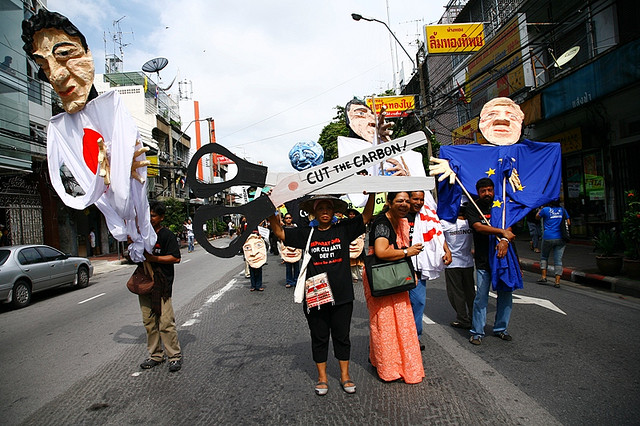 A giant scissors call for G8 and EU countries to cut down carbon emission